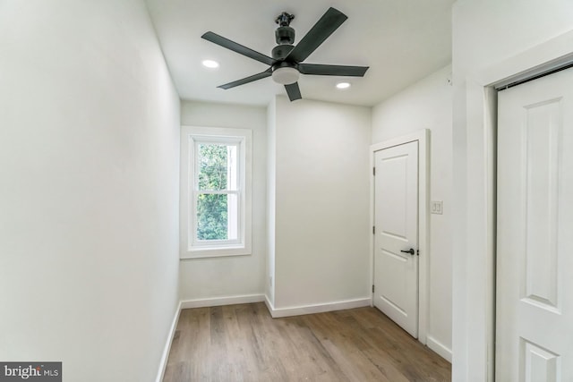 unfurnished room featuring light wood finished floors, a ceiling fan, baseboards, and recessed lighting