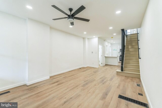 unfurnished living room featuring visible vents and recessed lighting