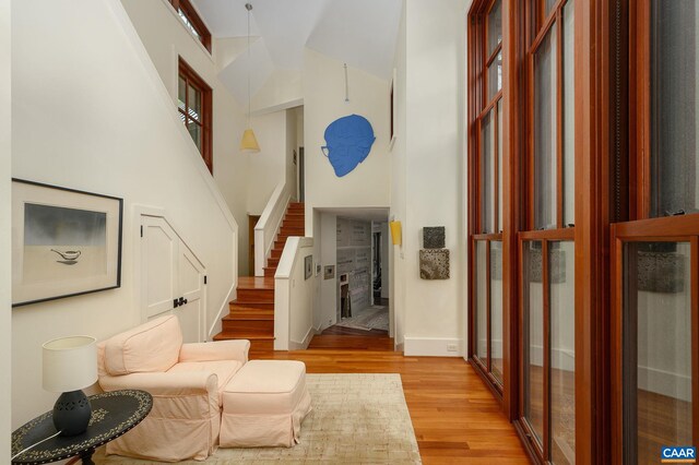 1112 Park St, Charlottesville, VA 22901 - interior space with stairway, a high ceiling, light wood-style floors, and baseboards