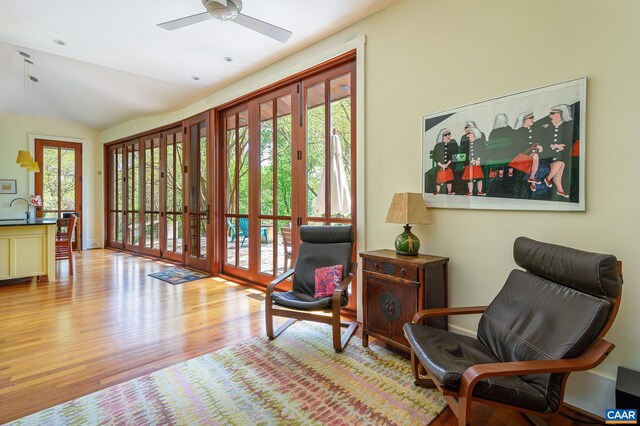 1112 Park St, Charlottesville, VA 22901 - living area with wood finished floors, lofted ceiling, baseboards, and ceiling fan