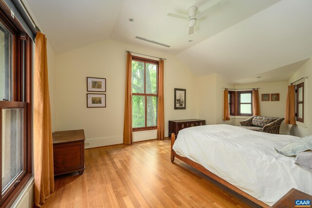 1112 Park St, Charlottesville, VA 22901 - bedroom featuring lofted ceiling, visible vents, a ceiling fan, light wood-type flooring, and baseboards
