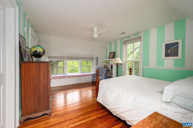 1112 Park St, Charlottesville, VA 22901 - bedroom featuring hardwood / wood-style floors, wallpapered walls, and a ceiling fan