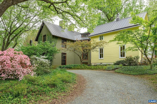 1112 Park St, Charlottesville, VA 22901 - exterior space with a standing seam roof, driveway, a chimney, and metal roof