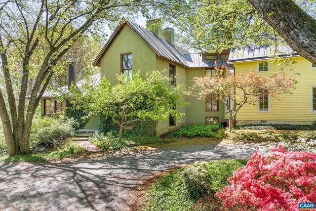 1112 Park St, Charlottesville, VA 22901 - exterior space featuring stucco siding, a standing seam roof, and metal roof