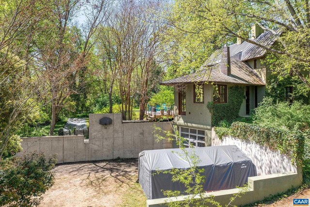1112 Park St, Charlottesville, VA 22901 - view of side of property with stucco siding and fence