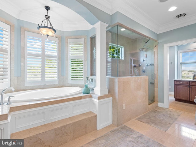 bathroom with crown molding, a bath, a shower stall, and decorative columns