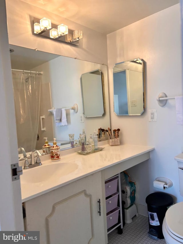 2300 Pimmit Dr Unit 601, Falls Church, VA 22043 - full bath featuring curtained shower, vanity, tile patterned flooring, and toilet