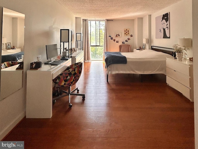2300 Pimmit Dr Unit 601, Falls Church, VA 22043 - bedroom with floor to ceiling windows, wood finished floors, a textured ceiling, and access to exterior