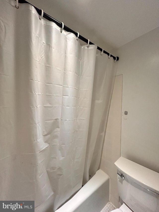 2300 Pimmit Dr Unit 601, Falls Church, VA 22043 - bathroom with shower / tub combo with curtain and toilet