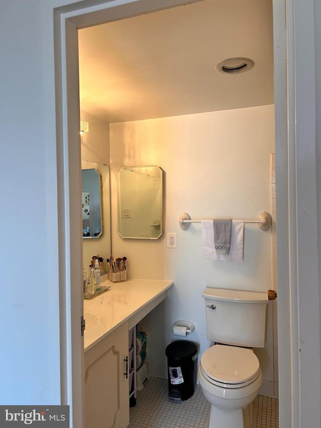 2300 Pimmit Dr Unit 601, Falls Church, VA 22043 - bathroom with tile patterned floors, vanity, and toilet