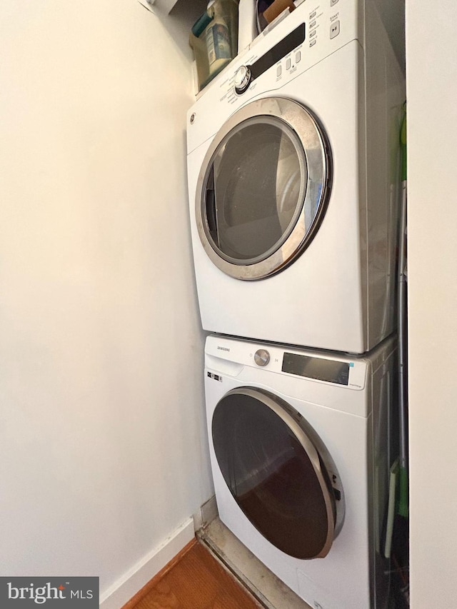 2300 Pimmit Dr Unit 601, Falls Church, VA 22043 - clothes washing area with stacked washer / drying machine and baseboards