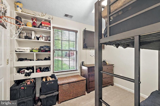 bedroom featuring visible vents, carpet flooring, baseboards, and multiple windows