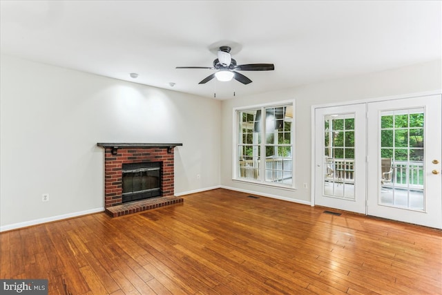 9409 Emory Grove Rd, Gaithersburg, MD 20877 - unfurnished living room featuring hardwood / wood-style floors, ceiling fan, a fireplace, and baseboards