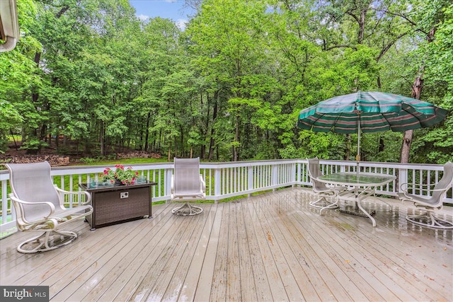 9409 Emory Grove Rd, Gaithersburg, MD 20877 - wooden deck featuring outdoor dining area and view of scattered trees