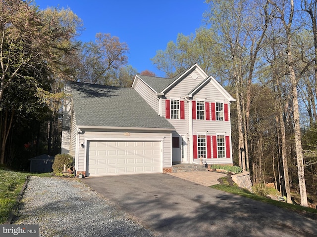 9409 Emory Grove Rd, Gaithersburg, MD 20877 - view of front facade with driveway, a garage, and roof with shingles