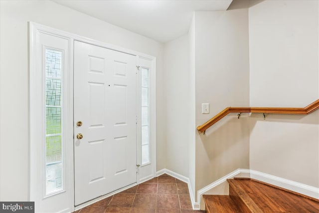 9409 Emory Grove Rd, Gaithersburg, MD 20877 - entrance foyer featuring baseboards, dark tile patterned flooring, and stairway