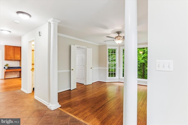 9409 Emory Grove Rd, Gaithersburg, MD 20877 - unfurnished living room featuring ornate columns, a ceiling fan, baseboards, light tile patterned floors, and ornamental molding