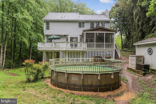 9409 Emory Grove Rd, Gaithersburg, MD 20877 - back of house featuring a sunroom, a chimney, a deck, stairs, and an outdoor pool