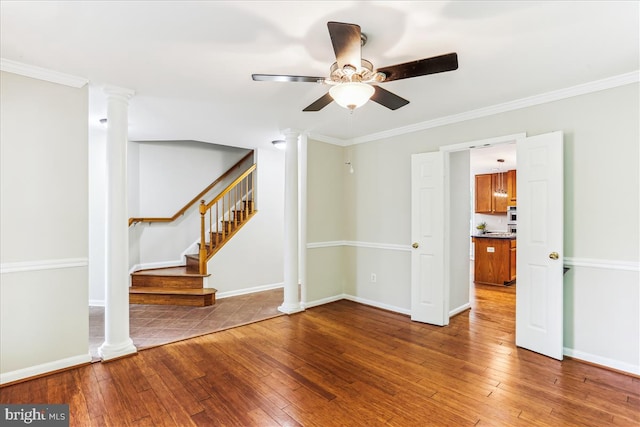 9409 Emory Grove Rd, Gaithersburg, MD 20877 - spare room featuring ornate columns, wood-type flooring, ceiling fan, stairway, and crown molding