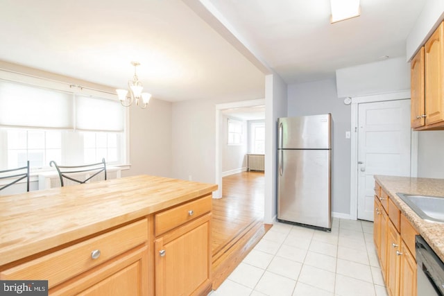 763 Humphreys Rd, Ardmore, PA 19003 - kitchen with freestanding refrigerator, wood counters, dishwashing machine, a chandelier, and light tile patterned flooring