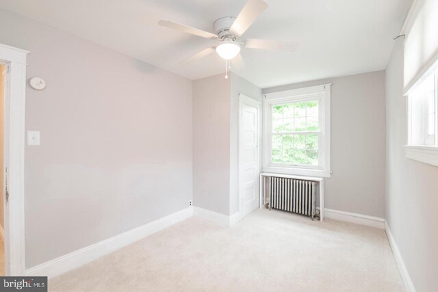763 Humphreys Rd, Ardmore, PA 19003 - spare room featuring radiator heating unit, ceiling fan, light carpet, and baseboards