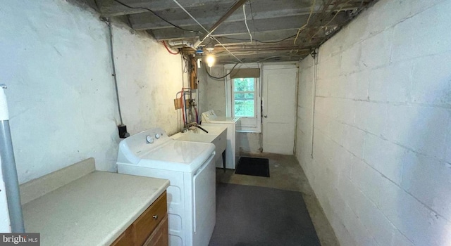 763 Humphreys Rd, Ardmore, PA 19003 - washroom featuring washing machine and dryer, cabinet space, and concrete block wall