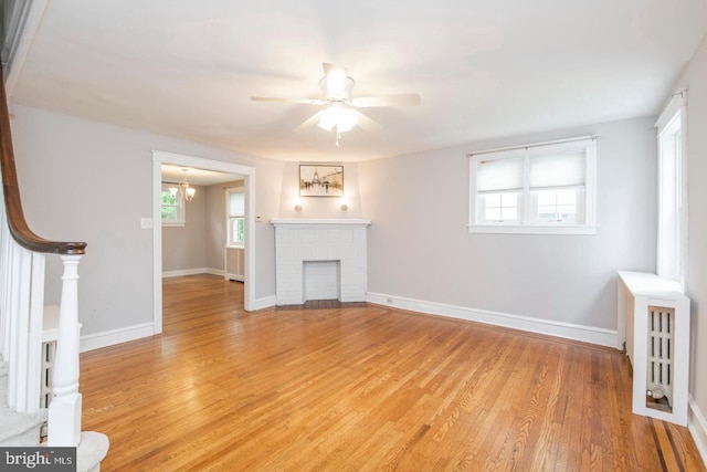 763 Humphreys Rd, Ardmore, PA 19003 - unfurnished living room with light wood-style floors, a ceiling fan, and plenty of natural light