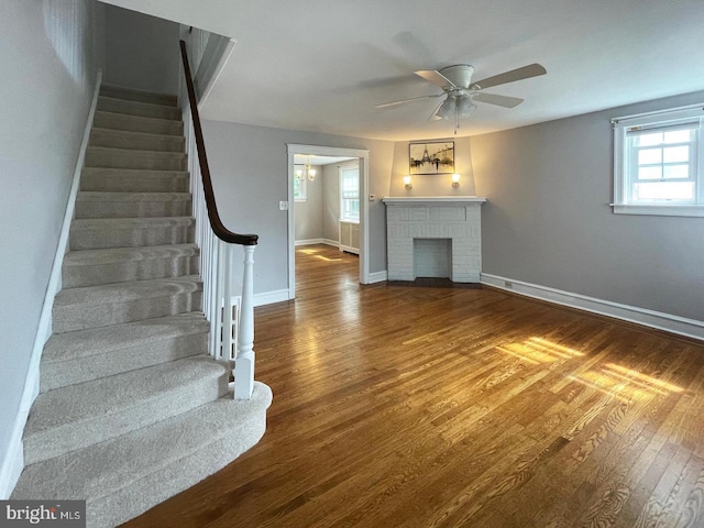 763 Humphreys Rd, Ardmore, PA 19003 - unfurnished living room with stairway, ceiling fan, plenty of natural light, and wood finished floors