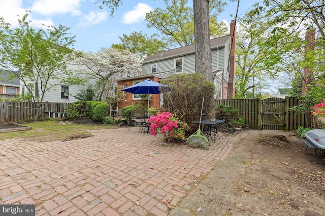1412 N Wakefield St, Arlington, VA 22207 - view of patio / terrace with a gate, outdoor dining area, and a fenced backyard