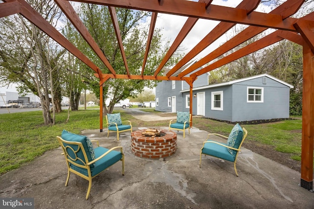 view of patio featuring a pergola, a fire pit, and an outdoor structure