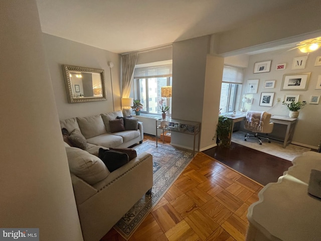 living room featuring a ceiling fan