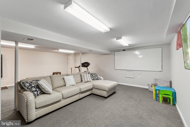 home theater room with carpet flooring, baseboards, and visible vents