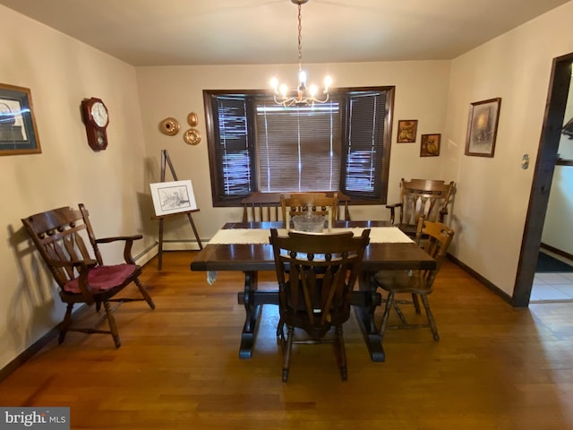 2060 Mahantongo St, Pottsville, PA 17901 - dining area with wood finished floors, a baseboard heating unit, baseboards, and a notable chandelier