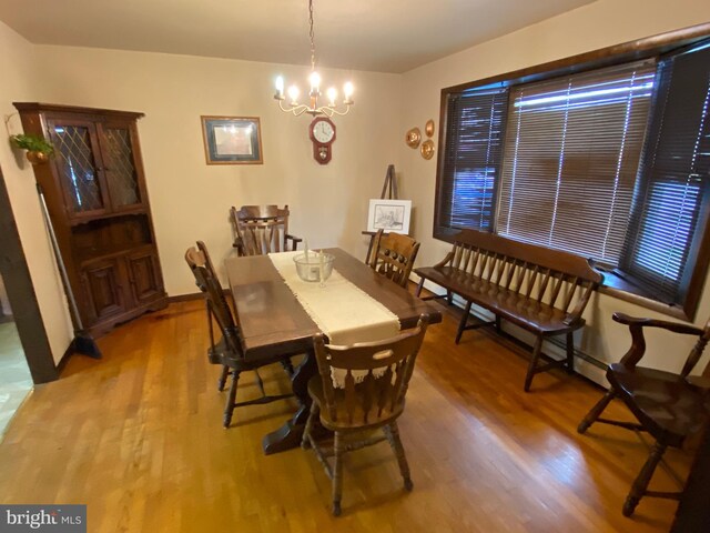 2060 Mahantongo St, Pottsville, PA 17901 - dining room with a chandelier, baseboards, and wood finished floors