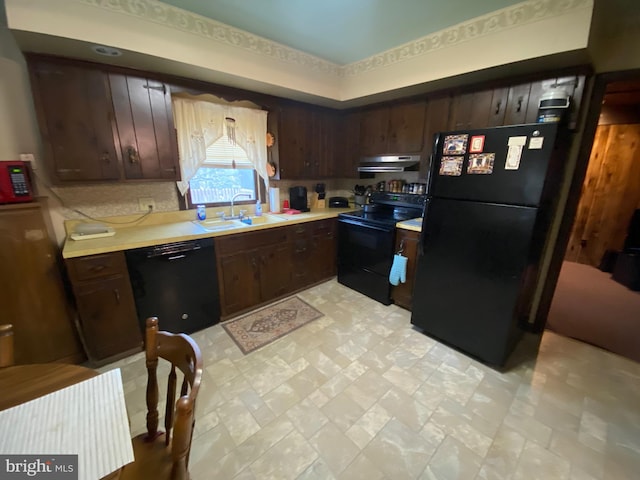 2060 Mahantongo St, Pottsville, PA 17901 - kitchen with a sink, light countertops, under cabinet range hood, dark brown cabinets, and black appliances