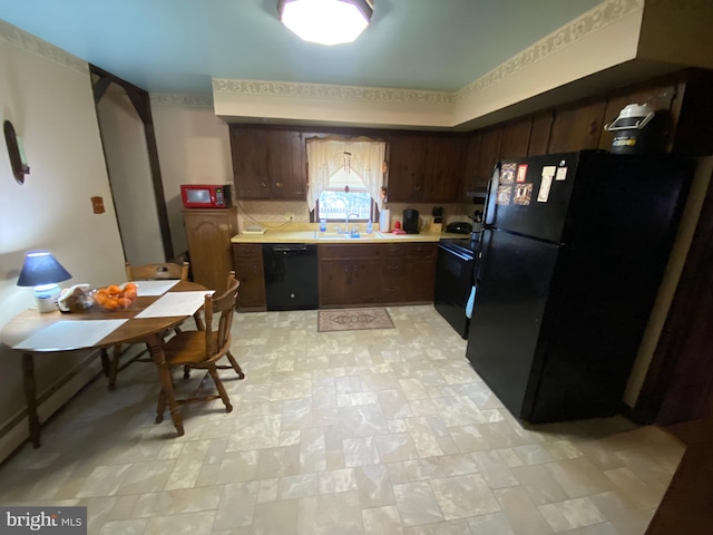 2060 Mahantongo St, Pottsville, PA 17901 - kitchen with light countertops, black appliances, and dark brown cabinetry