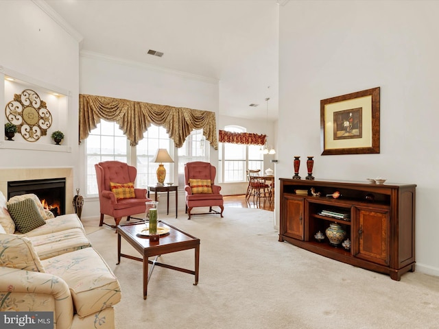 11110 Chambers Ct Unit N, Woodstock, MD 21163 - living area featuring visible vents, ornamental molding, a lit fireplace, and light carpet