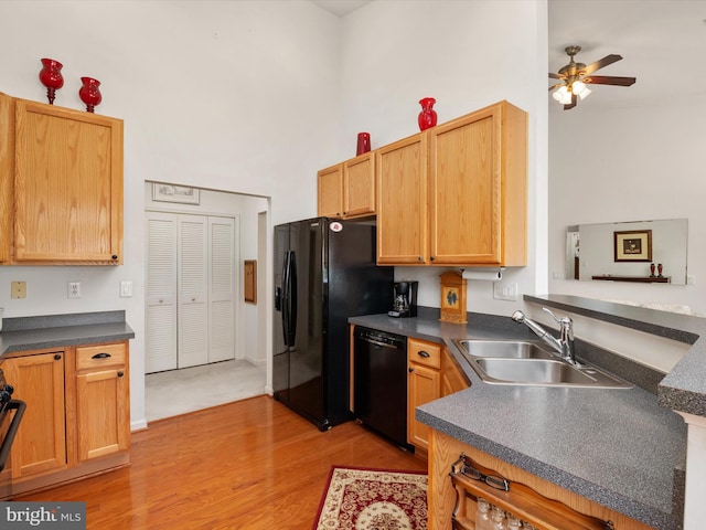 11110 Chambers Ct Unit N, Woodstock, MD 21163 - kitchen with a towering ceiling, dark countertops, a sink, light wood finished floors, and black appliances