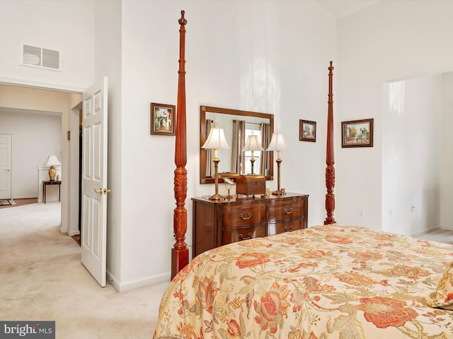 11110 Chambers Ct Unit N, Woodstock, MD 21163 - bedroom featuring baseboards, a high ceiling, light carpet, and visible vents