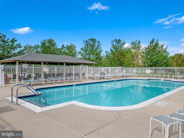 11110 Chambers Ct Unit N, Woodstock, MD 21163 - community pool with a patio and fence