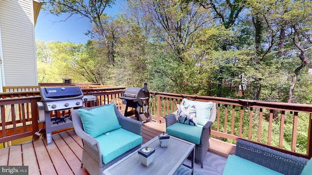wooden deck featuring grilling area and an outdoor living space