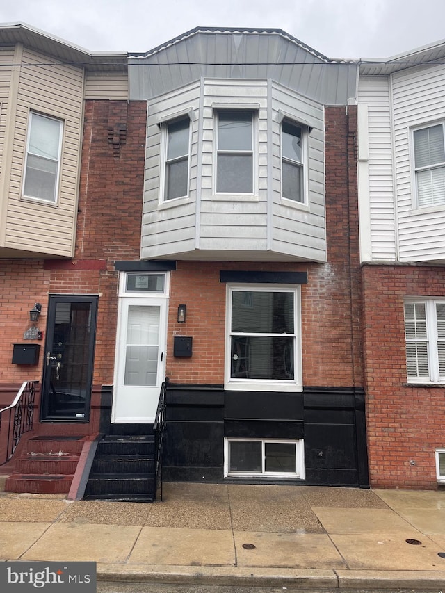 130 Fitzgerald St, Philadelphia, PA 19148 - view of property featuring entry steps and brick siding