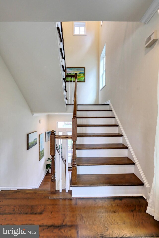 23280 Horse Island Rd, Lewes, DE 19958 - stairway featuring wood finished floors and baseboards