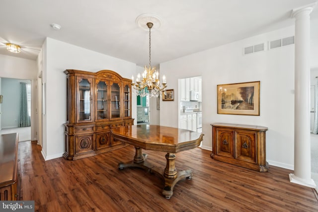 dining room with wood finished floors, visible vents, baseboards, and an inviting chandelier