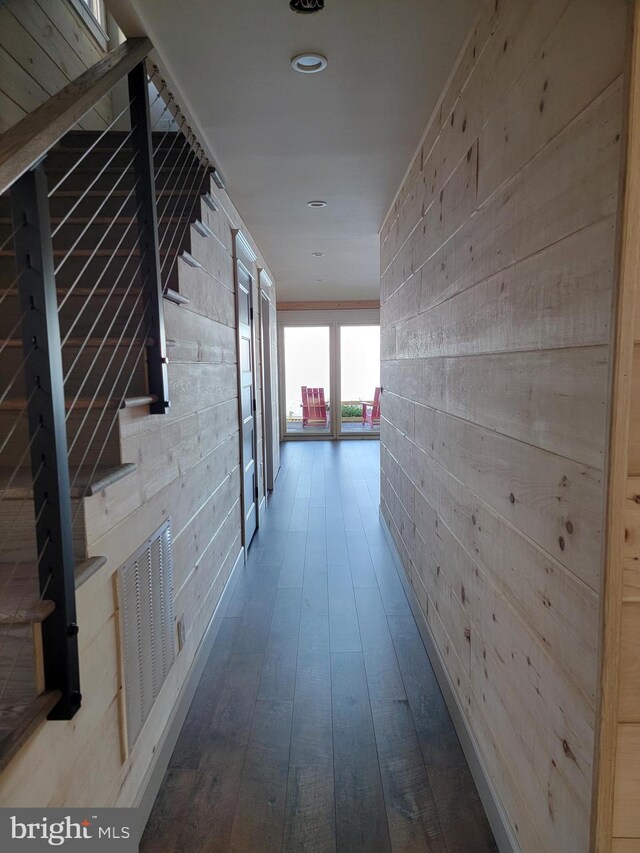 6555 Clagett Ave, Tracys Landing, MD 20779 - corridor featuring wooden walls, visible vents, and hardwood / wood-style flooring