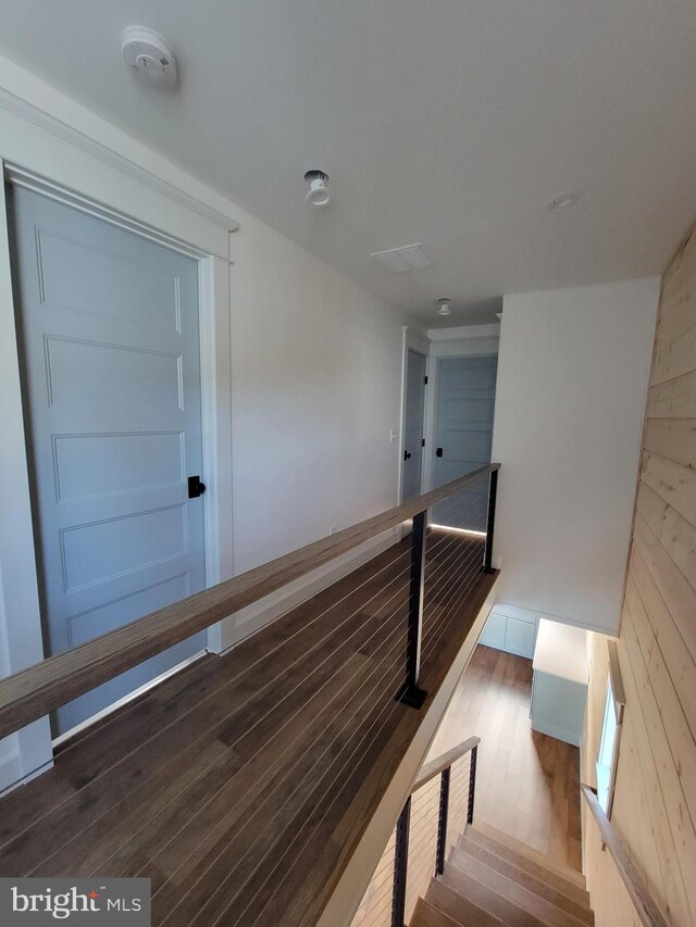 6555 Clagett Ave, Tracys Landing, MD 20779 - staircase featuring wood walls and wood finished floors