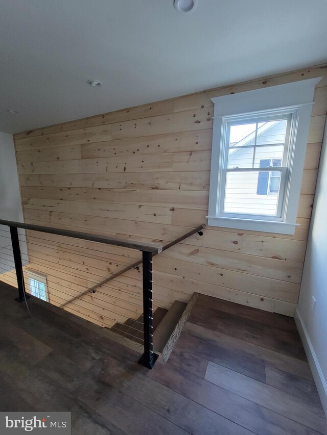 6555 Clagett Ave, Tracys Landing, MD 20779 - additional living space with baseboards, wood finished floors, and wooden walls