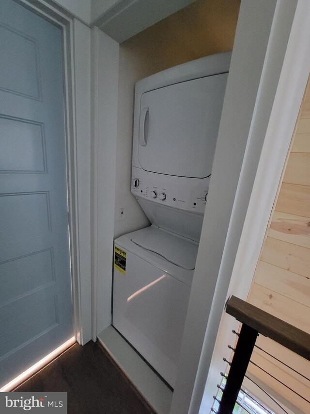 6555 Clagett Ave, Tracys Landing, MD 20779 - laundry room with stacked washing maching and dryer and laundry area