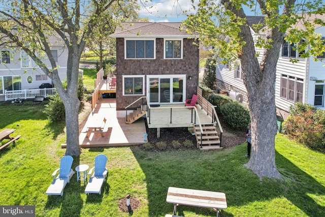 6555 Clagett Ave, Tracys Landing, MD 20779 - back of house featuring a yard, a shingled roof, stairs, and a deck