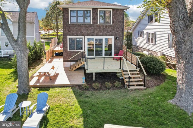 6555 Clagett Ave, Tracys Landing, MD 20779 - rear view of house with a lawn, stairway, and a deck